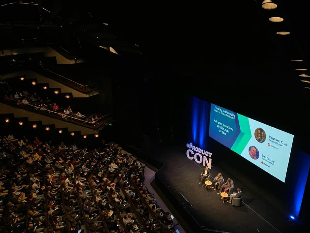 panel discussion at tech conference using presentation technology